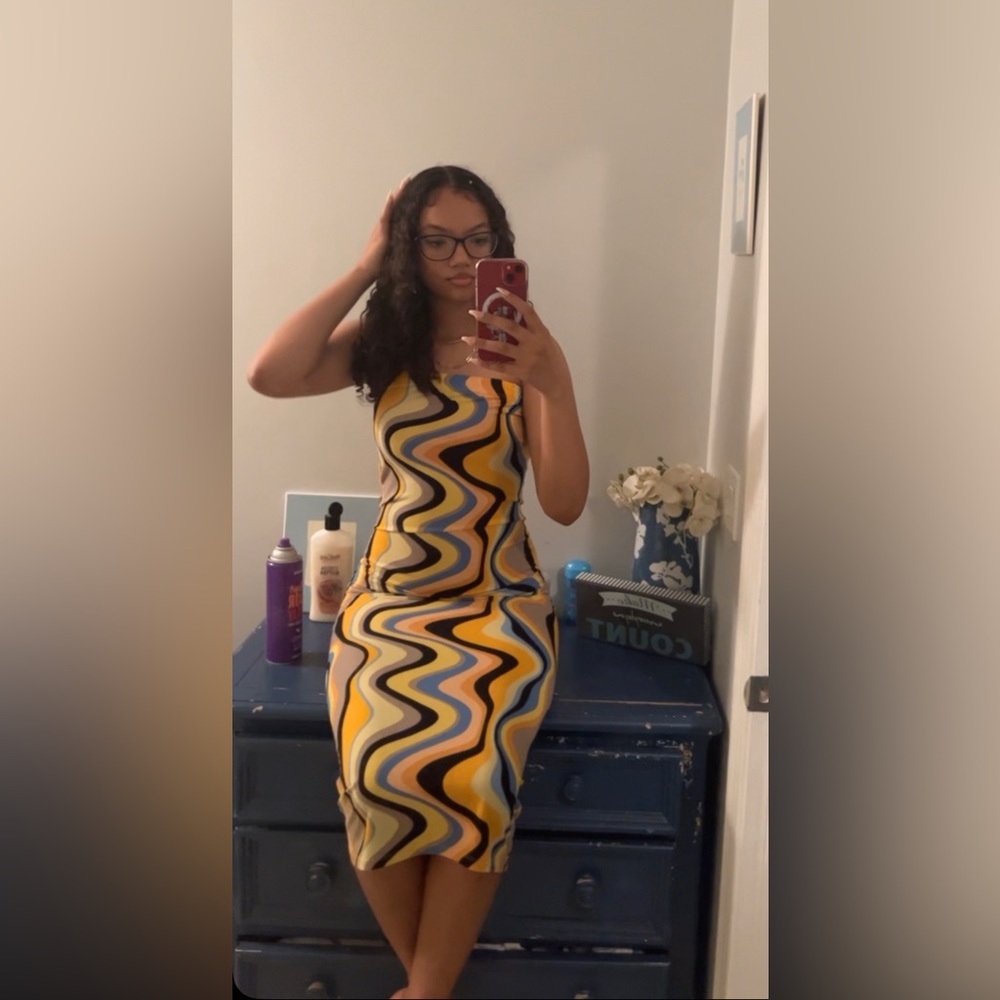 black, orange, yellow, blue, and peach colored strapless dress